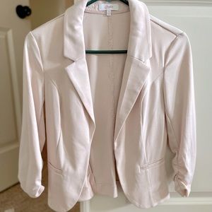 Light pink blazer.